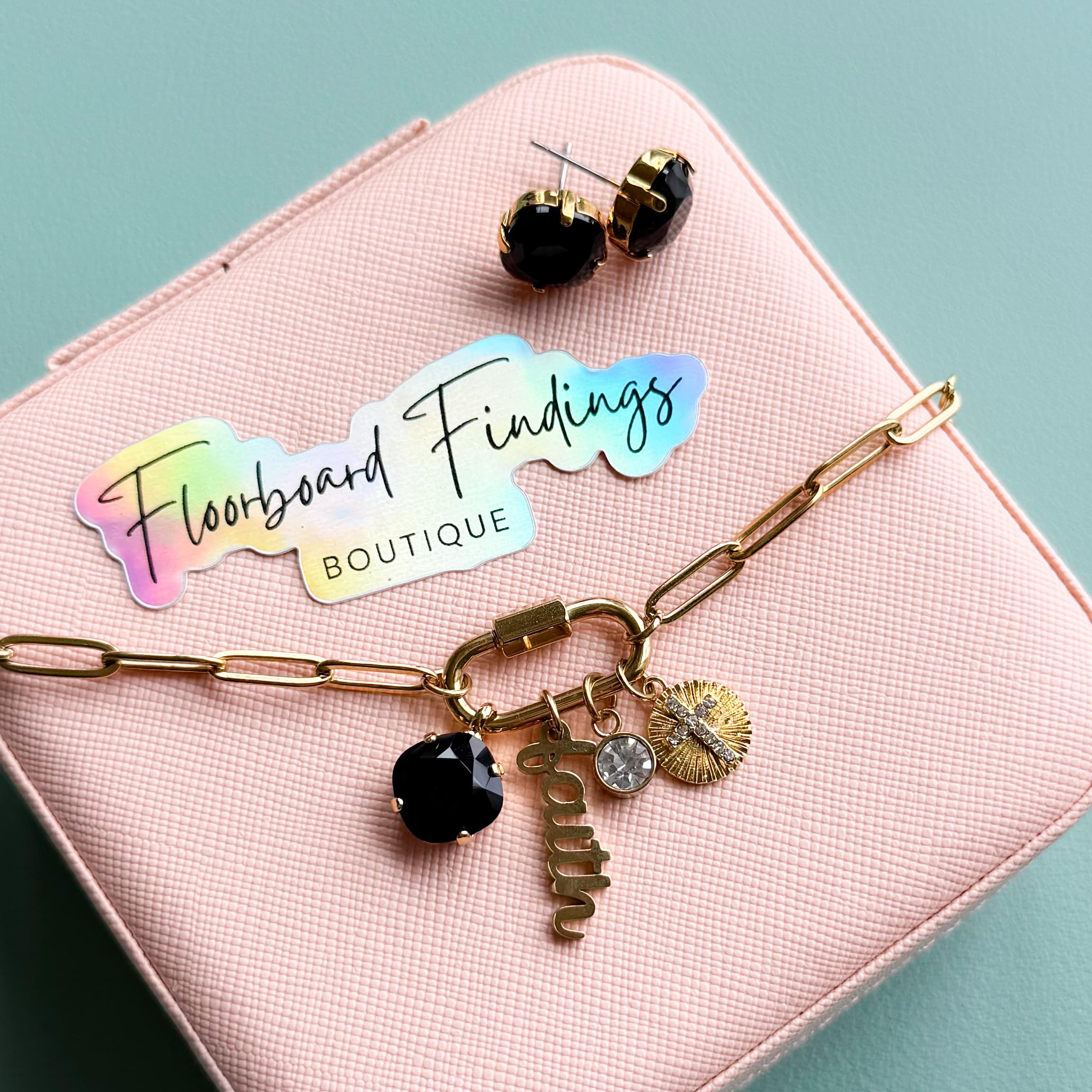 Black Swarovski crystal stud earrings and gold charm bracelet with Floorboard Findings holographic sticker